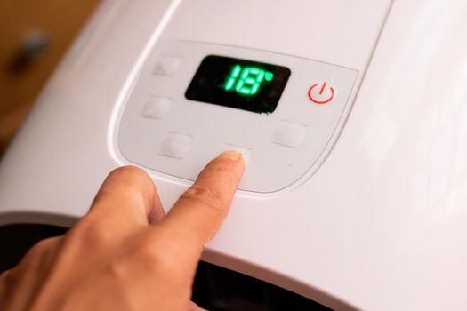 The set temperature on the air conditioner display close up