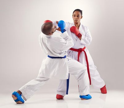 Two people doing karate.