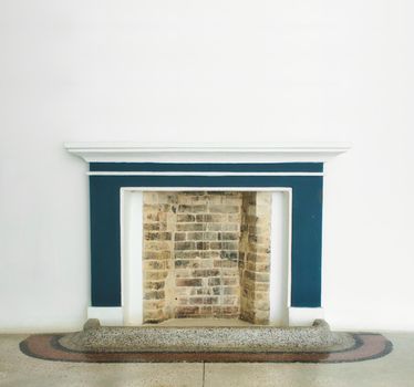 Bricked-up fireplace mock-up in a modern furnish interior room with empty, white walls