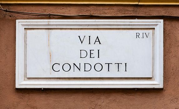 Rome, Italy. Street plate of the famous Condotti Road - Via dei Condotti - center of the Roman luxury shopping