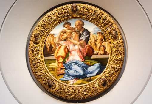 Florence, Italy - Circa August 2021: Holy Family with the Young St. John Baptist - named Doni Tondo - by Michelangelo Buonarroti, 1507