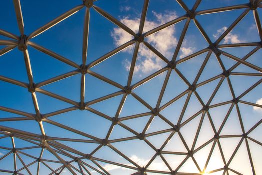 Modern design curved steel frame structure under a blue sky