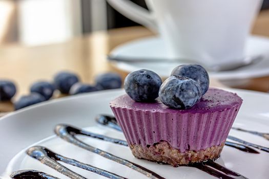 Delicious cake with blackberry-blueberry mousse. Closeup view.