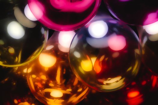Abstract multi-colored glass light bulbs with a warm glow