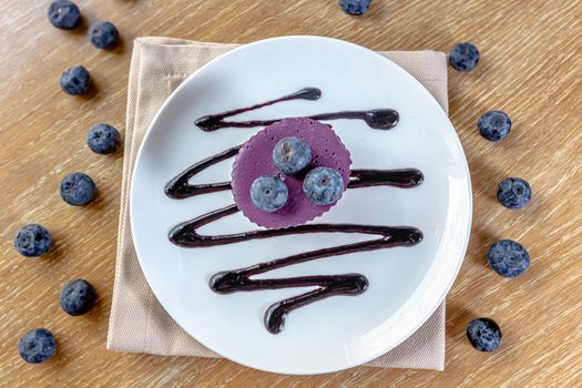 Delicious cake with blackberry-blueberry mousse. Closeup view.
