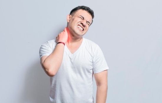 Man with neck and back muscle pain, Close up of man with neck and back pain, a man with muscle pain on isolated background, Neck and back pain concept