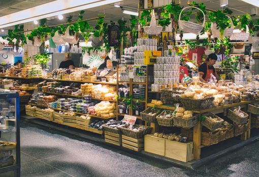 STOCKHOLM, SWEDEN - FEBRUARY 21, 2019: Hotorgshallen Saluhall food market - food and drink for sale at a stall