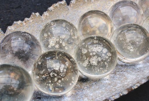 Decorative glass spheres with pockets of air inset bubbles