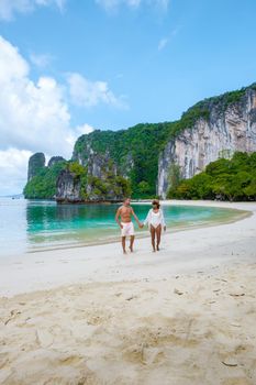 Koh Hong Island Krabi Thailand, a couple of men and women on the beach of Koh Hong, a tropical white beach with Asian women and European men in Krabi Thailand