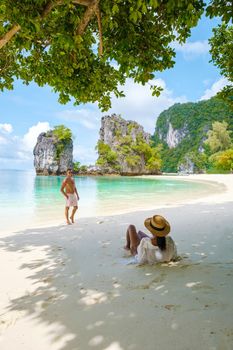 Koh Hong Island Krabi Thailand, a couple of men and women on the beach of Koh Hong, a tropical white beach with Asian women and European men in Krabi Thailand