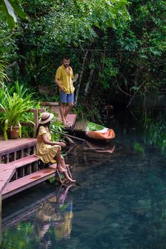 Klong Sa Kaew Krabi Thailand mangrove forest is popular for kayaking in the river of Krabi Thailand. Young Asian woman and European men at the lake