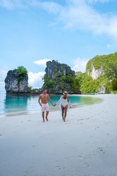 Koh Hong Island Krabi Thailand, a couple of men and women on the beach of Koh Hong, a tropical white beach with Asian women and European men in Krabi Thailand