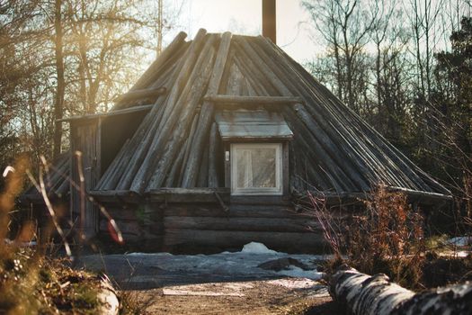 A traditional wooden log cabin on in the forest