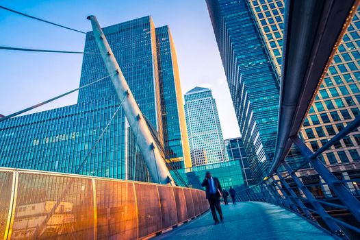 Businessman walking in financial district city.