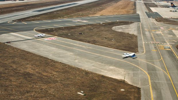 Seville / Spain - August 28 2019: Light aircraft on the runway of Seville airport during the day