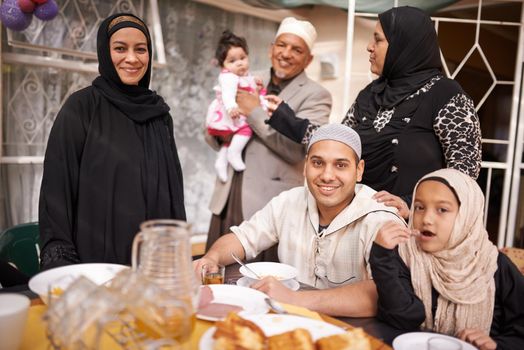 Shot of a muslim family eating together.