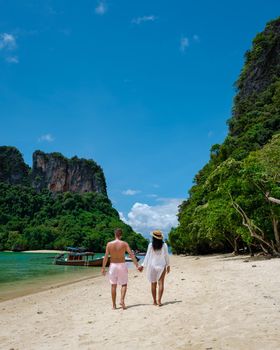 Koh Phakbia Island is near Koh Hong Krabi, a beautiful white sandy beach in Krabi Thailand. Young Asian woman and European men on the beach.