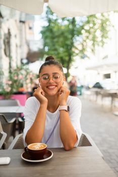 Portrait close up of young beautiful girl, on background street