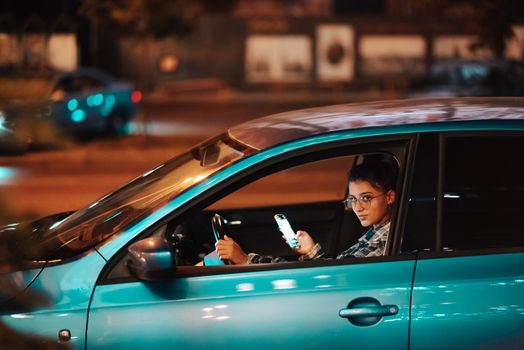 Young lost female driver using mobile phone while driving