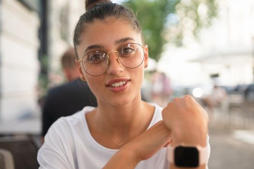 Portrait close up of young beautiful girl, on background street