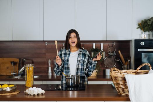Woman is preparing food in the kitchen. Cooking At Home. Prepare Food.