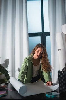 Portrait of young woman at her workplace in the home. Success conception