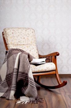 modern rocking chair near a light wall