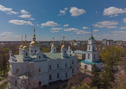 Aerial view to The Assumption Cathedral and his bell tower in Poltava, orthodox church at summer