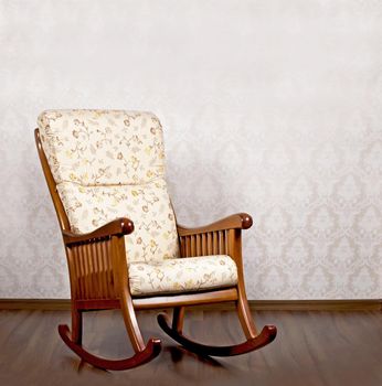 modern rocking chair near a light wall