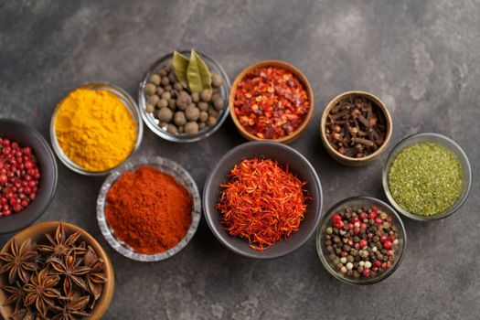 Assortment of natural spices on dark rustic stone background, Healthy spice concept