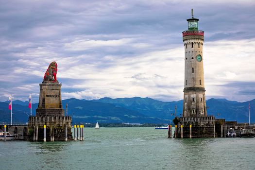 The famous harbor entrance of Lindau Bavarian Lion and New Lighthouse on Bodensee lake view, Bavaria region of Germany