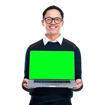 Portrait of a young businessman holding a laptop on a white background.
