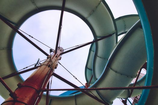 View from below a water slide looking up through the built structure