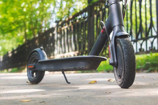 Electric scooter on the background of the city close up