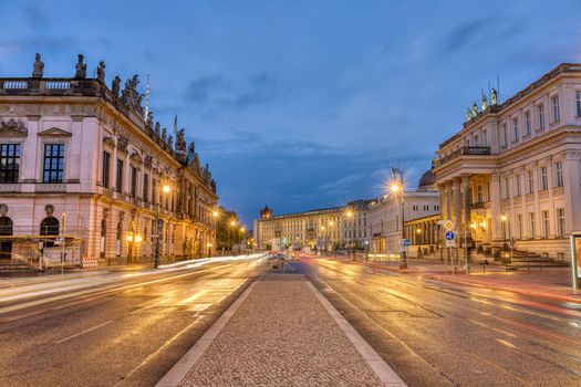 The famous Unter den Linden boulevard in Berlin with its historic buildings at night