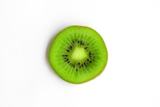 Slice of kiwi fruit isolated on white background. High quality photo