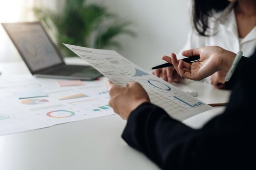 Business People Meeting to discuss and brainstorming the financial report paperwork in home office. Financial advisor teamwork and accounting concept