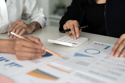 Co-working Business Team meeting Planning Strategy Analysis investment and saving concept. meeting discussing new plan financial graph data on calculator