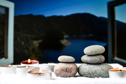 Zen concept, spa pebbles stones and burning aroma candles on blurred background, Treatment aromatherapy and massage, copy space for text