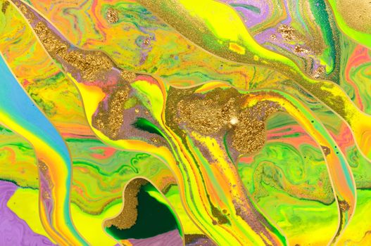 Gold dust and waves with fluorescent inks background. Yellow marble template