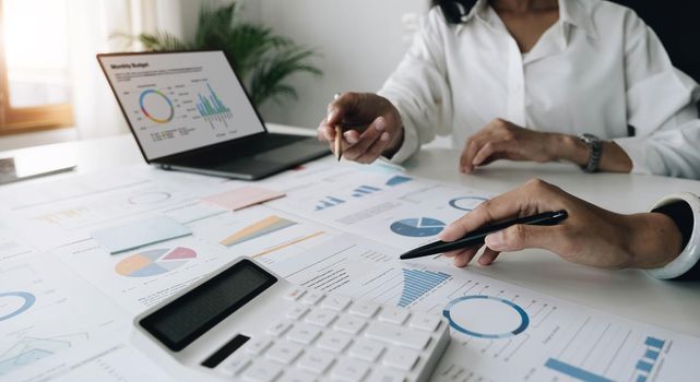 Team of business people are meeting to analyze data for marketing plan,Market research reports and income statistics, Financial and Accounting concept..