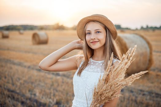 Portrait of a girl on nature in the evening