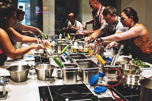 Valletta / Malta - September 31 2019: Students and teacher in the kitchen at a cooking course