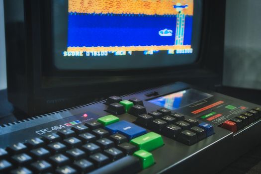 Mosta / Malta - July 3 2019: Amstrad CPC 464 keyboard and monitor displaying a retro computer game
