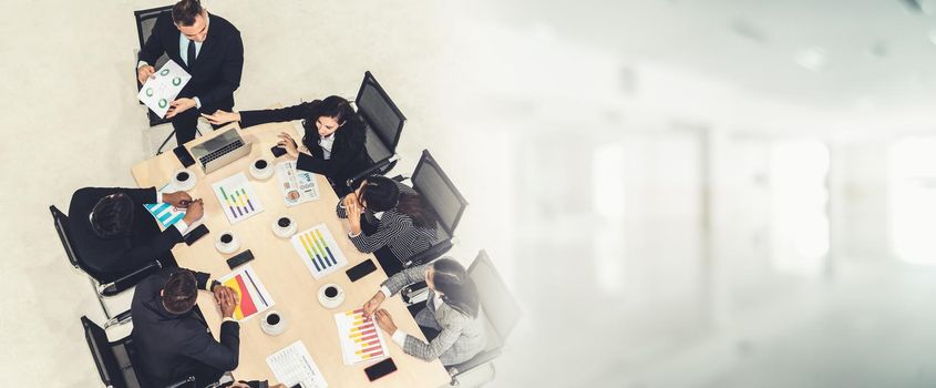 Business people group meeting shot from top view in office . Profession businesswomen, businessmen and office workers working in team conference with project planning document broaden view .