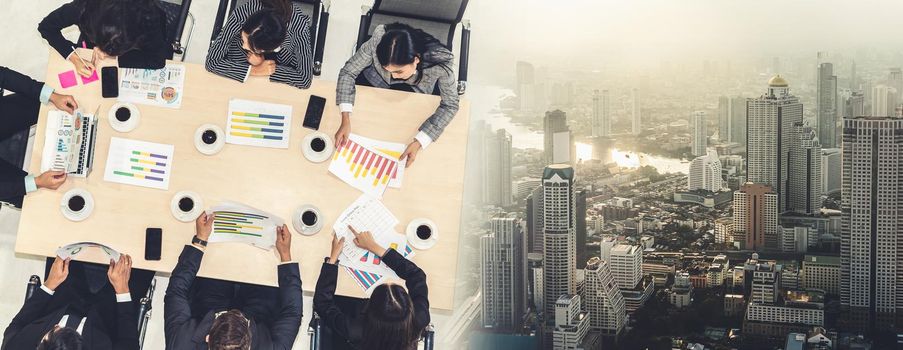 Business people group meeting shot from top view in office . Profession businesswomen, businessmen and office workers working in team conference with project planning document broaden view .