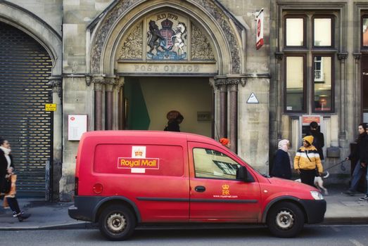 Oxford, UK - 02 March 2020: A red Royal Mail van parked in the street outside a post office