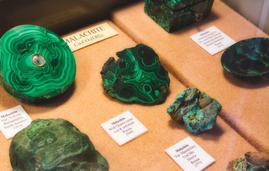 Rabat / Malta - November 25 2018: Collection of Malachite stones on display as part of a geological mineral exhibit