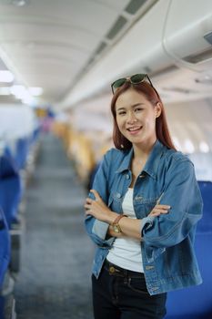 travel business Portrait of an Asian woman showing joy while waiting for a flight.