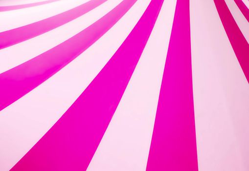 Abstract vintage pop art background design with thick pink and white stripes with copyspace for text
